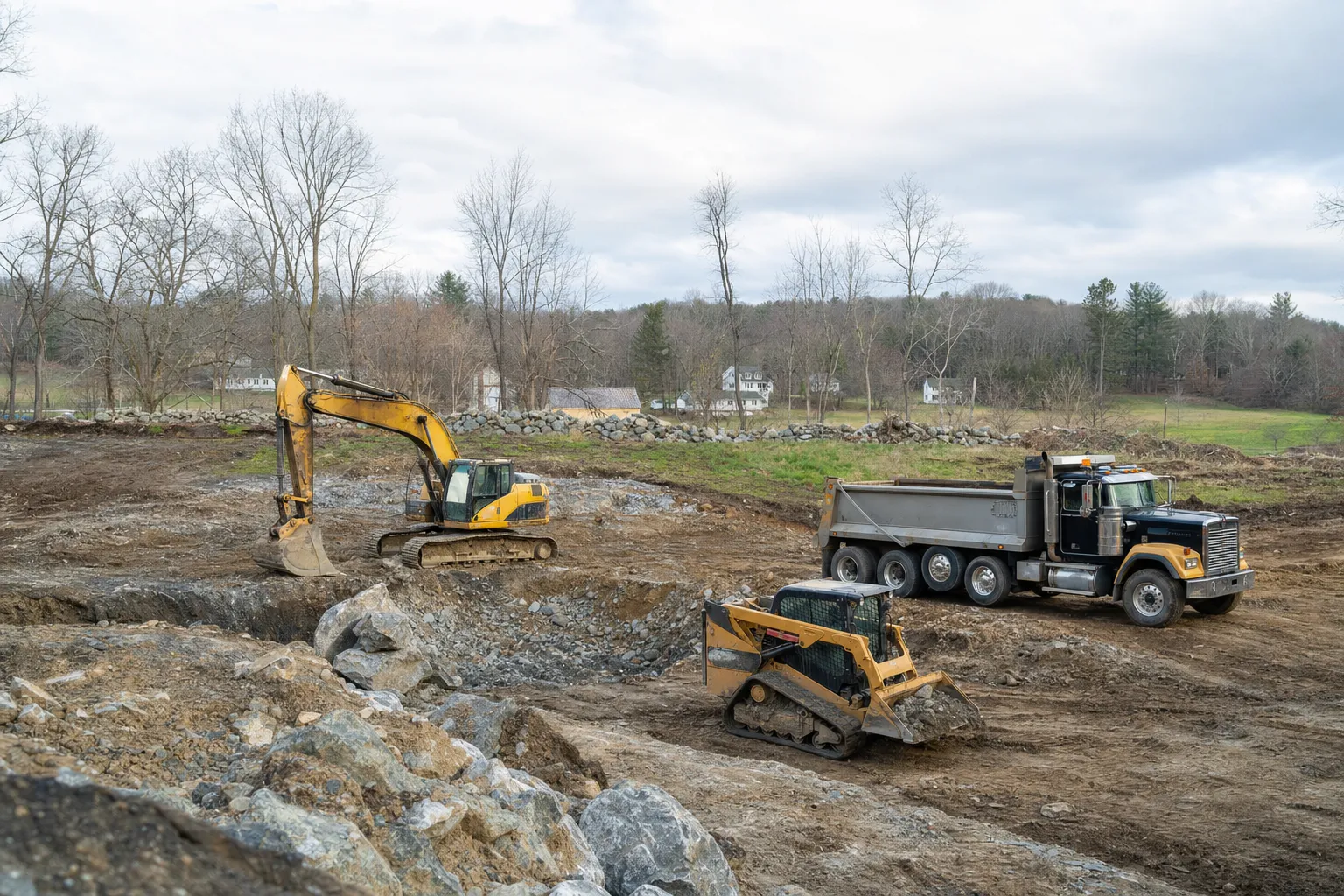 Excavation crew and equipment working on a job site in Sprague, Connecticut