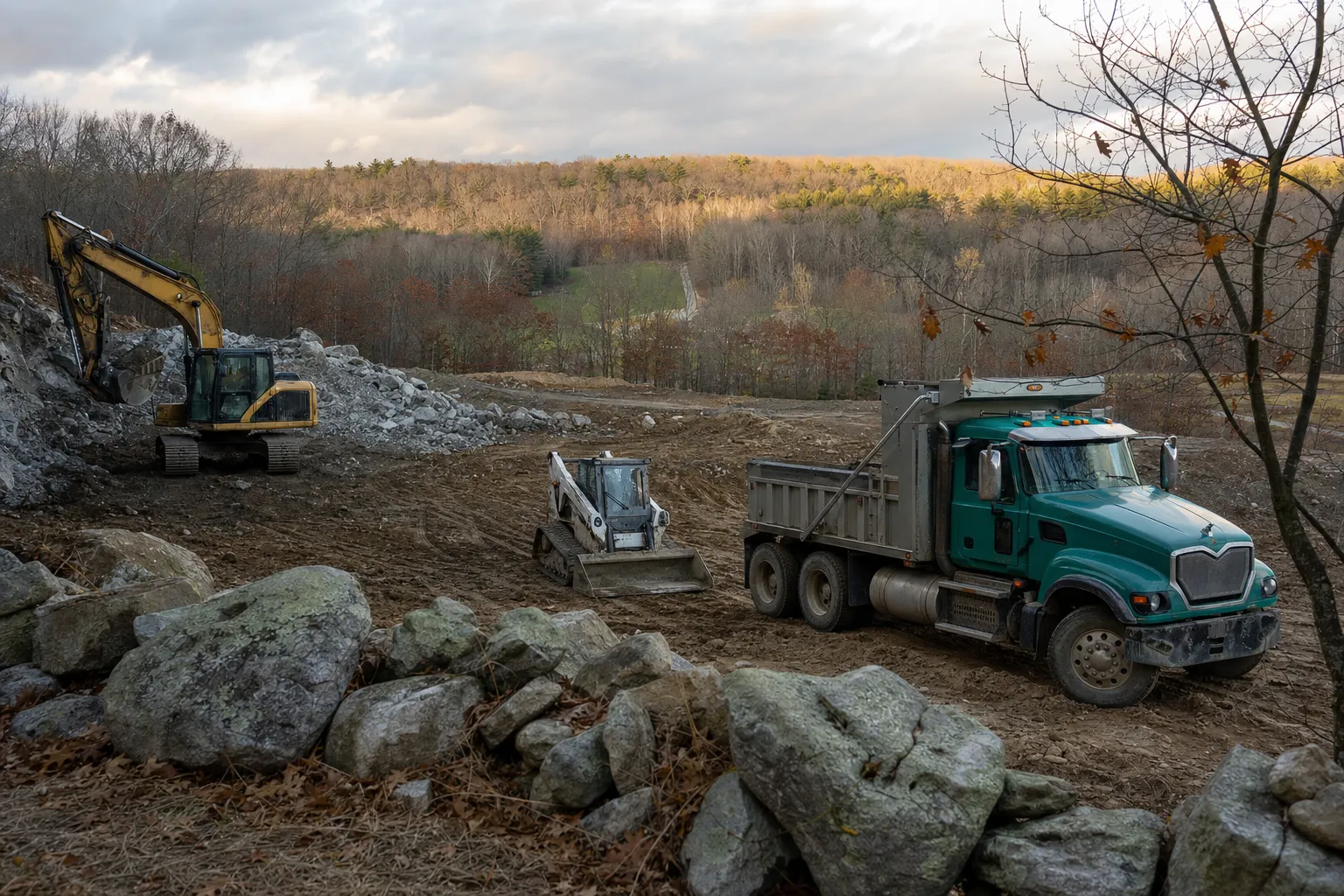 Excavation crew and equipment working on a job site in Thompson, Connecticut